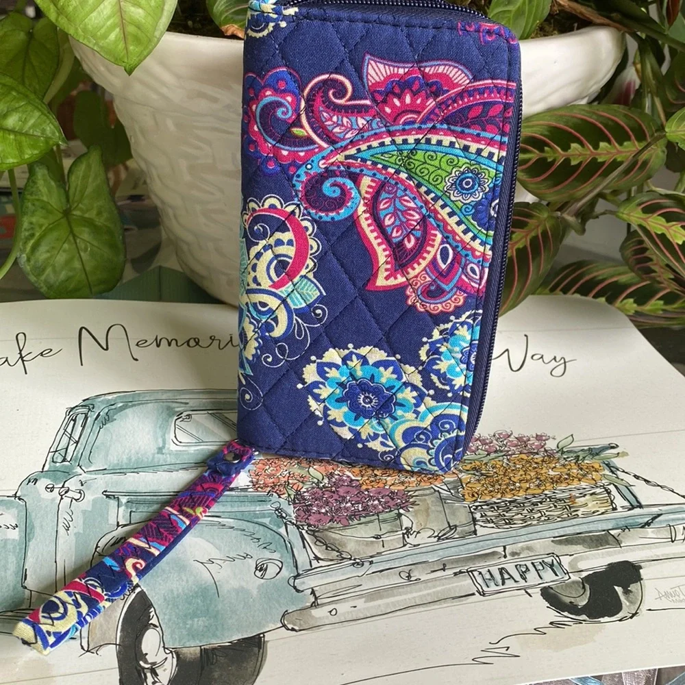 Paisley print wristlet ITEMS $8 or less BOGO . Bundle I will discount.